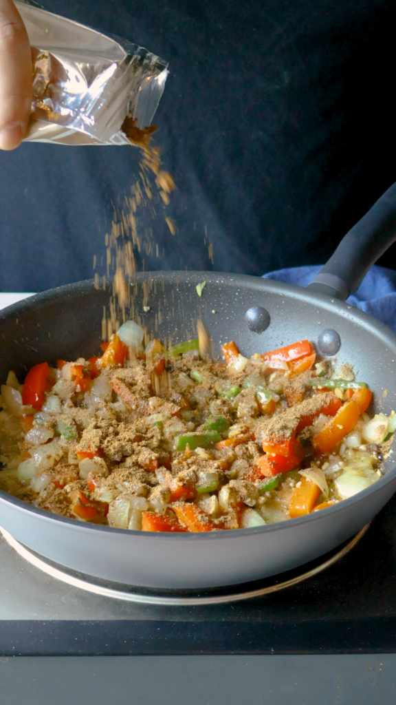 Add ginger and garlic and cook until fragrant, then stir in garam masala, cumin, turmeric and salt.